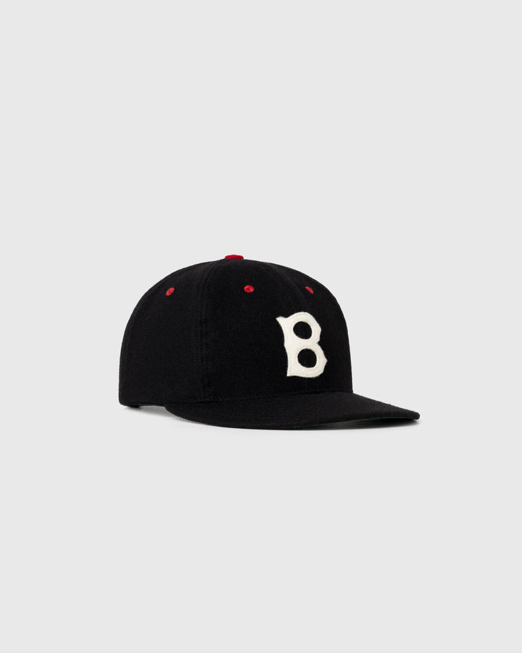 The EFF Baltimore Elite Giants 1947 Authentic Wool Ballcap features a black design with a white B on the front and red accents, shown on a plain light gray background.