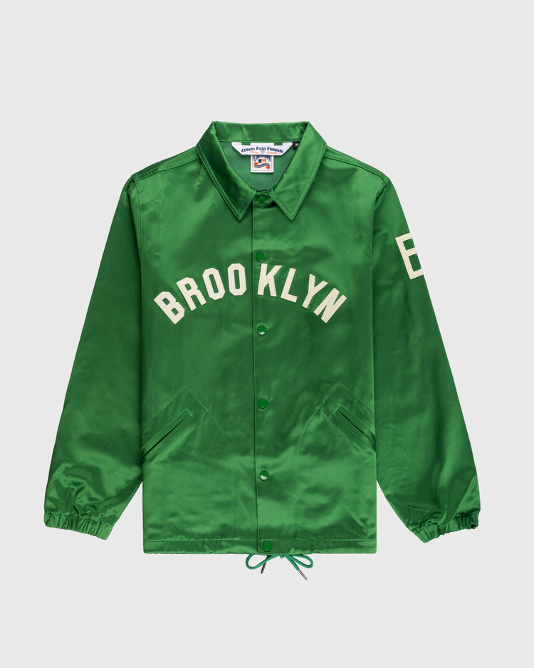 The EFF Brooklyn Dodgers 1937 Satin Windbreaker Jacket features green satin, BROOKLYN in white across the chest, number 8 on the left sleeve, front pockets, a collar, and elastic cuffs. It is laid flat on a white background.