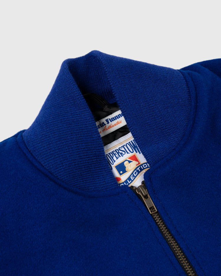 Close-up of a royal blue Brooklyn Dodgers 1940 Authentic Wool & Leather Varsity Jacket by EFF, featuring a ribbed collar and partially unzipped to show labels inside, evoking the spirit of Ebbets Field.
