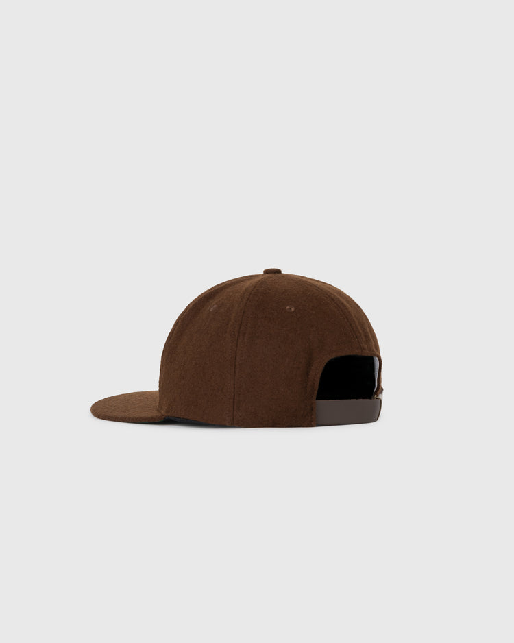 The EFF Cordoba Cafeteros 1957 Authentic Wool Ballcap is shown from the back, highlighting its brown wool, curved brim, and adjustable metal-buckle strap. This cap honors Mexican baseball history and is set against a plain light gray background.