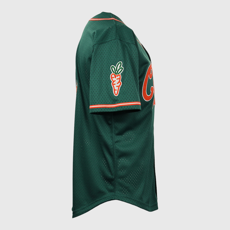 The EFF Carrots Arlington Heights Collection Button-Up Mesh Jersey in green mesh with orange trim features a carrot patch on the sleeve and partial orange front lettering, shown from a side view. Made in collaboration with Carrots and Ebbets Field Flannels.