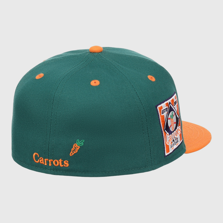 The EFF Carrots Arlington Heights Collection Logo Fitted Ballcap is green with orange accents, an orange button and brim, star side patch, and Carrots text plus carrot graphic on the back. Part of the Carrots Ebbets Field Flannels collection.