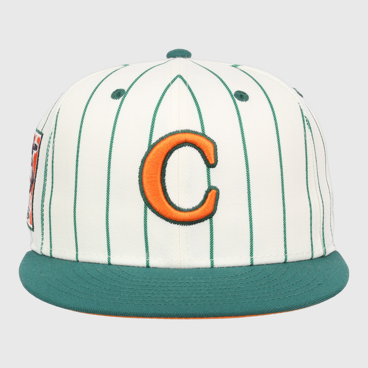 The EFF Carrots Arlington Heights Collection Pinstripe Fitted Ballcap features white fabric with green pinstripes, a green brim, and an orange C outlined in green, made in collaboration with Ebbets Field Flannels.