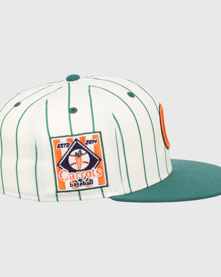 The Carrots Arlington Heights Collection Pinstripe Fitted Ballcap by EFF features white fabric with green pinstripes, a green flat brim, an embroidered Carrots baseball patch, and a modern structured crown.