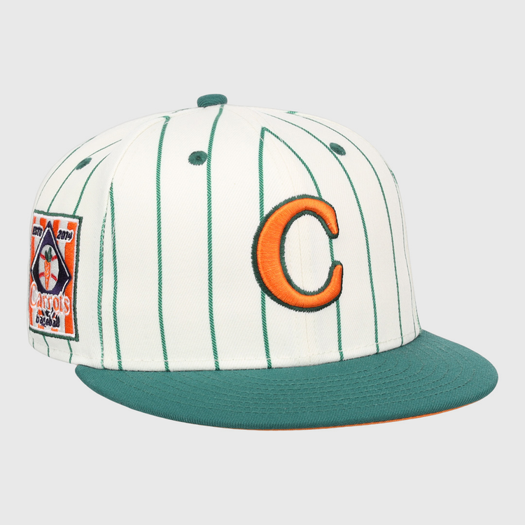 The EFF Carrots Arlington Heights Collection Pinstripe Fitted Ballcap features green pinstripes on white, a green brim, an orange “C” front logo, and Carrots patch—part of the Arlington Heights x EFF collab.