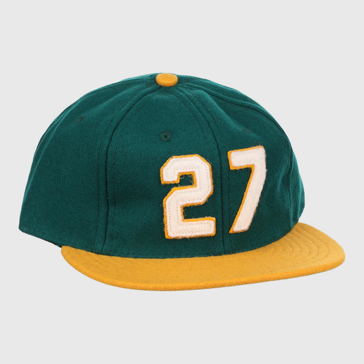 The Catfish Hunter Signature Series Ballcap by Ebbets Field Flannels is a green vintage wool cap with a yellow brim and button, featuring number 27 in white with yellow trim—an homage to National Baseball Hall of Fame legends.