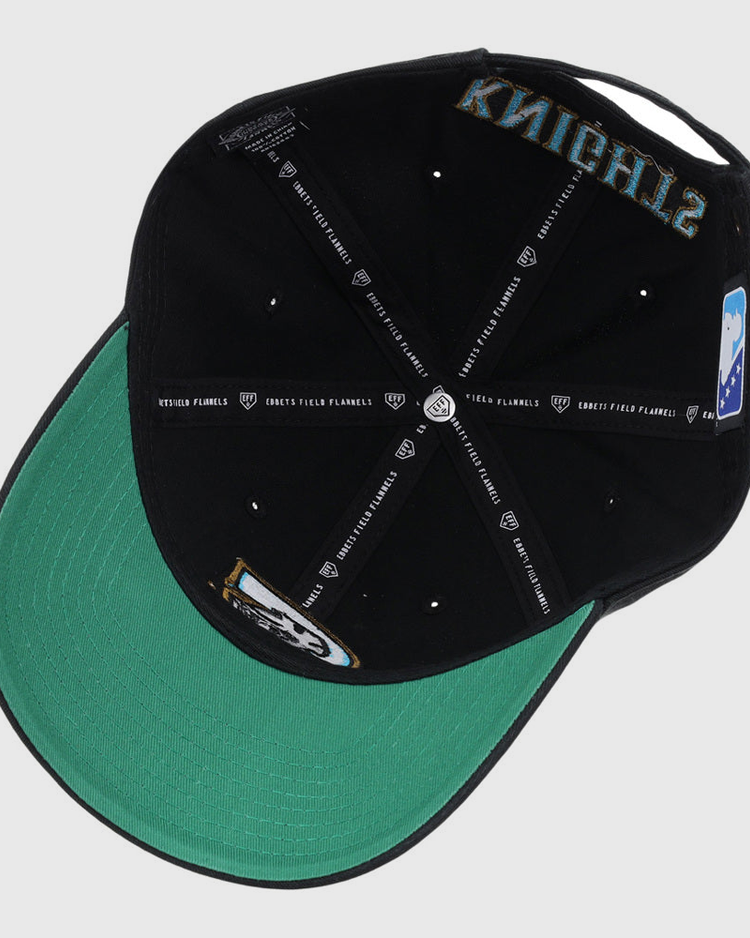 A black Charlotte Knights MiLB Dad Ballcap by Ebbets Field shown from underneath, with a green brim, visible stitching, interior logos, and 
