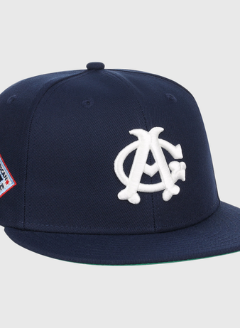 The EFF Chicago American Giants NLB Team Color Fitted Ballcap features a navy crown, flat brim, white AC logo on the front, and a red, white, and blue side patch—perfect for collectors.