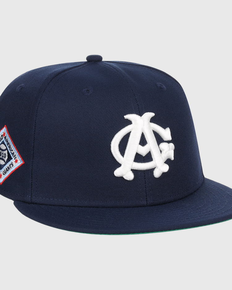 The EFF Chicago American Giants NLB Team Color Fitted Ballcap features a navy crown, flat brim, white AC logo on the front, and a red, white, and blue side patch—perfect for collectors.