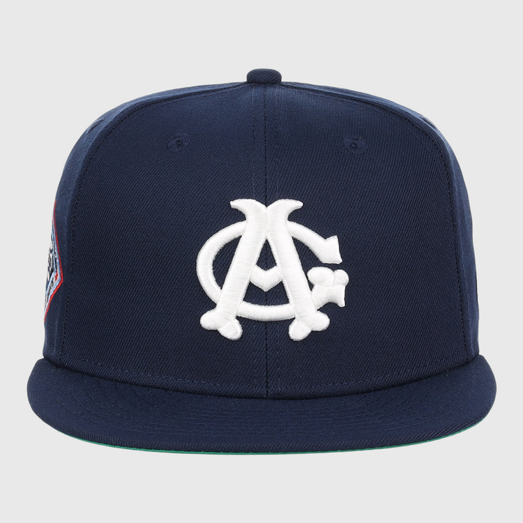 The EFF Chicago American Giants NLB Team Color Fitted Ballcap features a navy crown and visor, white interlocking AC logo on the front, and a left-side patch—perfect for classic baseball style.