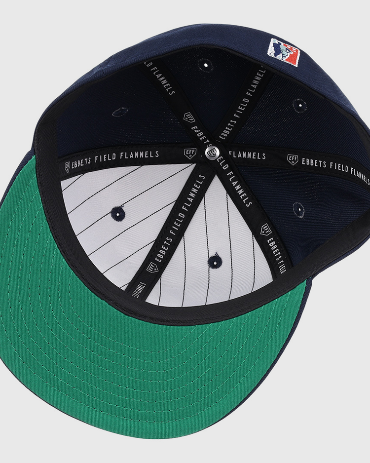 The Chicago American Giants NLB Team Color Fitted Ballcap by EFF features a navy crown, green underbrim, white pinstriped lining, black EFF-branded bands, and an MLB patch.