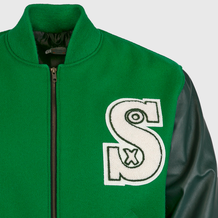 The EFF Chicago White Sox 1932 Authentic Jacket features kelly green fabric, black leather sleeves, a front zipper, and a bold white S patch with a small x—reviving classic varsity style.