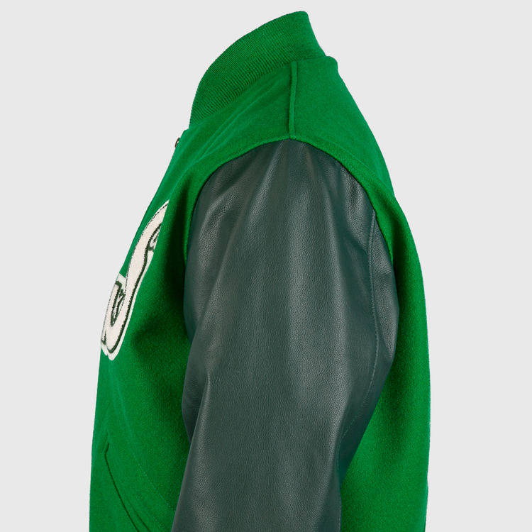 Side view of the EFF Chicago White Sox 1932 Authentic Jacket with dark green leather sleeves, kelly green wool body, and a partially visible white patch with black trim on the chest.