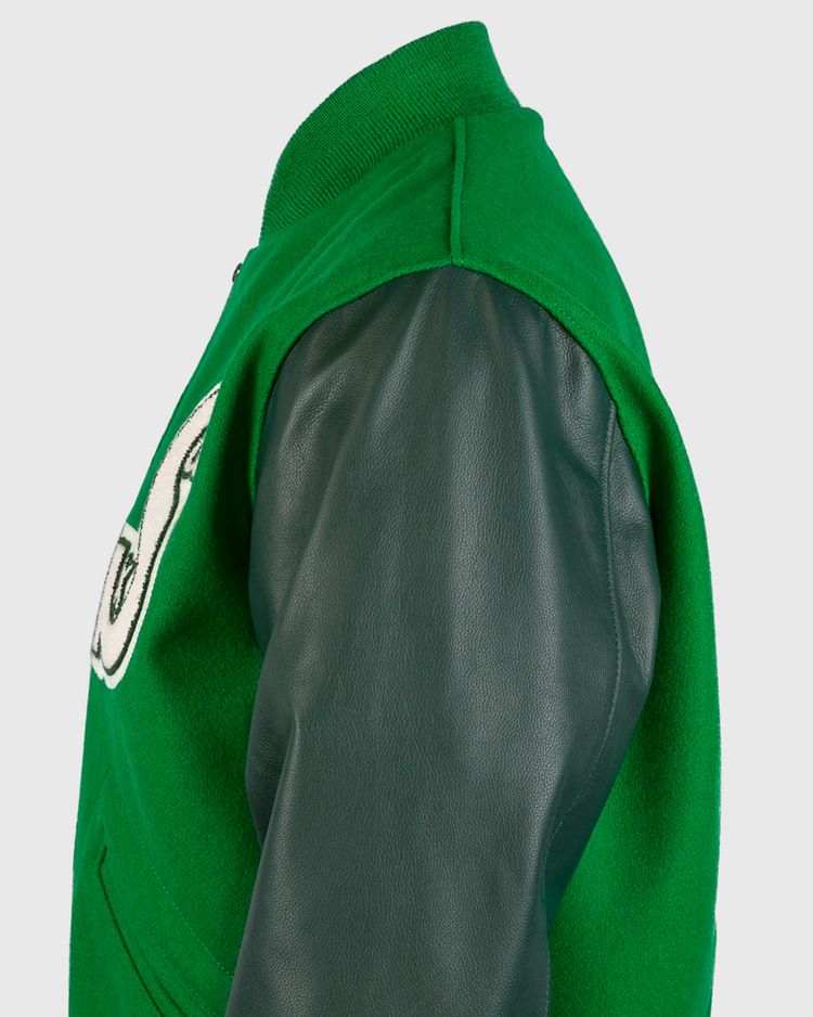 Side view of the EFF Chicago White Sox 1932 Authentic Jacket with dark green leather sleeves, kelly green wool body, and a partially visible white patch with black trim on the chest.