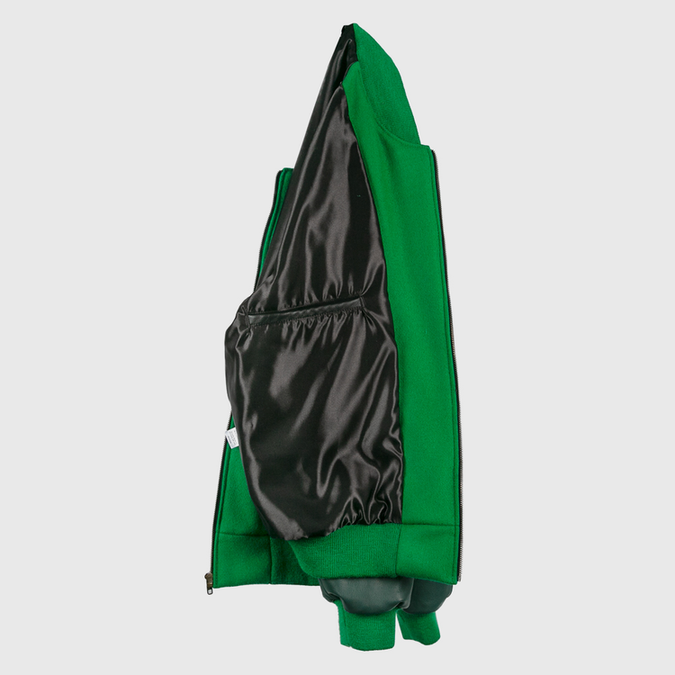 The EFF Chicago White Sox 1932 Authentic Jacket in kelly green is shown inside out, highlighting its black shiny lining and interior pocket, with the vintage-inspired look of a classic 1932 reproduction.
