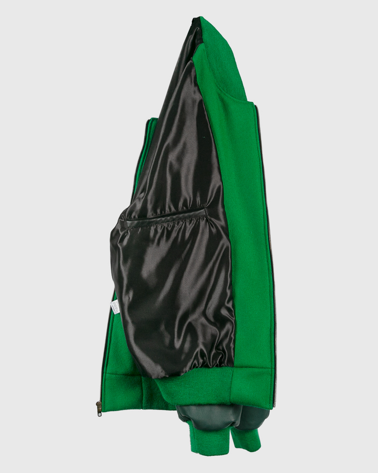 The EFF Chicago White Sox 1932 Authentic Jacket in kelly green is shown inside out, highlighting its black shiny lining and interior pocket, with the vintage-inspired look of a classic 1932 reproduction.