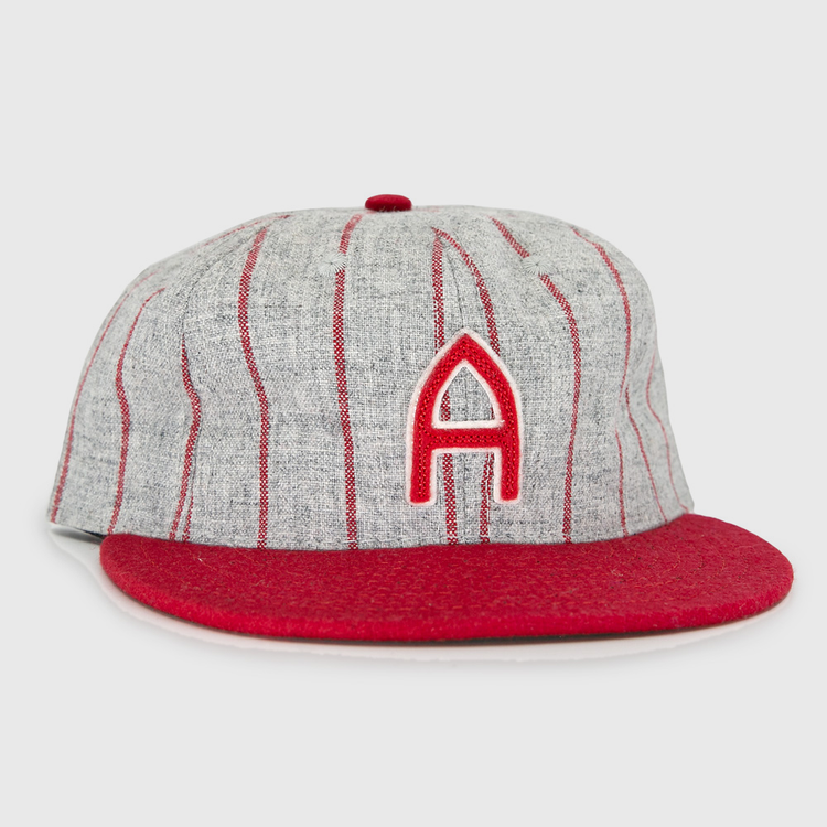 The Club Artemisa 1943 Vintage Ballcap by Ebbets Field Flannels features genuine grey wool, thin red stripes, a red brim, and a bold red A on the front, inspired by the Cuban National Amateur League team.