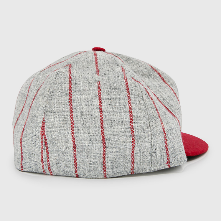 The Club Artemisa 1943 Vintage Ballcap by Ebbets Field Flannels features gray wool with vertical red stripes, a solid red brim, and a classic back view inspired by the Cuban National Amateur League.