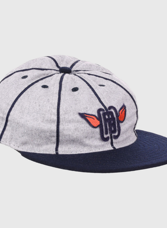The EFF Columbia Park 1909 Vintage 8-Panel Ballcap is a gray cap with a navy visor and seams, featuring an embroidered blue letters and red wings logo on the front, inspired by classic Columbia Park Boys Club style.