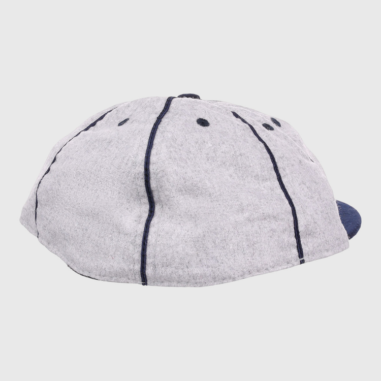 The EFF Columbia Park 1909 Vintage 8-Panel Ballcap features a gray design with dark blue stitching and ventilation holes, shown from back and side angles—a timeless choice for any Columbia Park Boys Club fan.