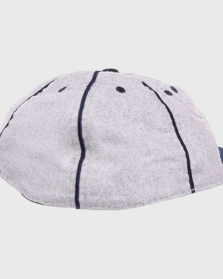 The EFF Columbia Park 1909 Vintage 8-Panel Ballcap features a gray design with dark blue stitching and ventilation holes, shown from back and side angles—a timeless choice for any Columbia Park Boys Club fan.