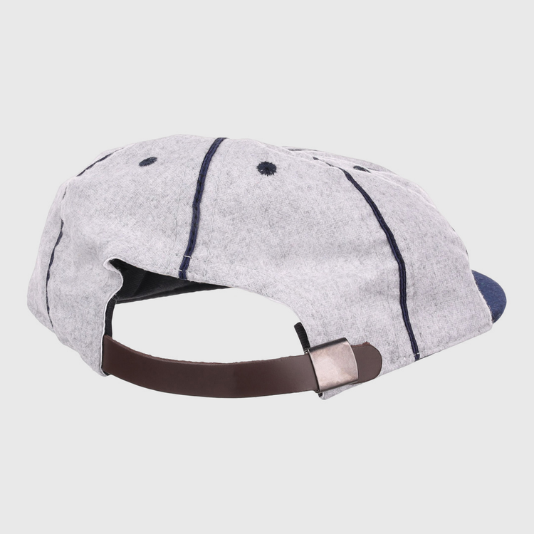 The EFF Columbia Park 1909 Vintage 8-Panel Ballcap is light gray with dark blue stitching, ventilation eyelets, and an adjustable brown leather strap with a metal clasp—perfect for fans of the Columbia Park Boys Club.