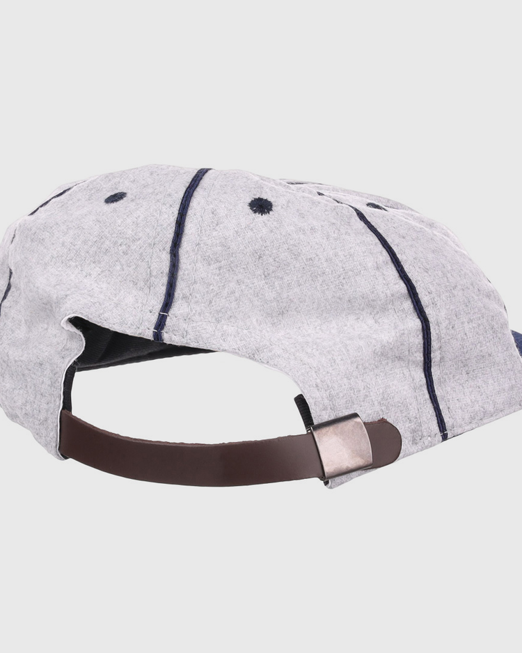The EFF Columbia Park 1909 Vintage 8-Panel Ballcap is light gray with dark blue stitching, ventilation eyelets, and an adjustable brown leather strap with a metal clasp—perfect for fans of the Columbia Park Boys Club.