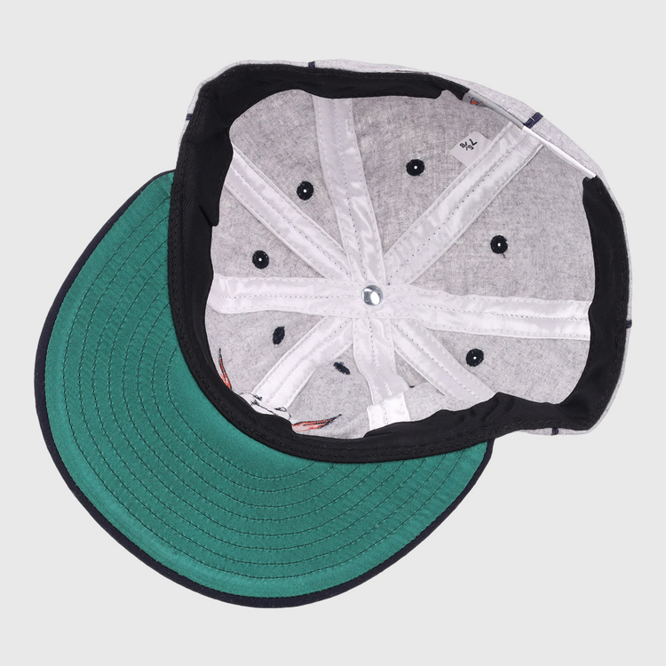 The image shows the inside of an EFF Columbia Park 1909 Vintage 8-Panel Ballcap with a green brim, gray lining, black sweatband, visible stitching, and ventilation holes. The cap is laid flat with the brim facing left.