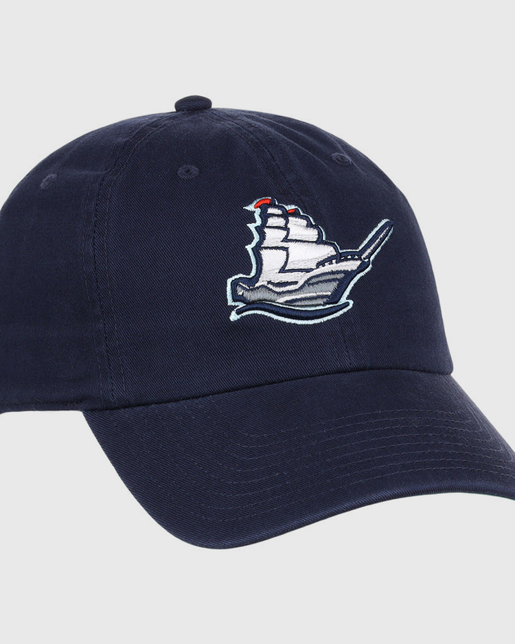 The Ebbets Field Columbus Clippers MiLB Dad Ballcap is a navy blue cap with an embroidered white sailing ship and red flags on the front panel.