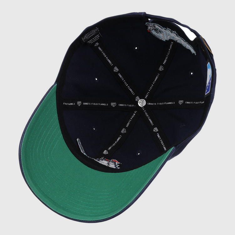 The Ebbets Field Columbus Clippers MiLB Dad Ballcap features a green brim, embroidered grey mice, small red dots on the inner navy panels, and black logo-printed taping across the inside.