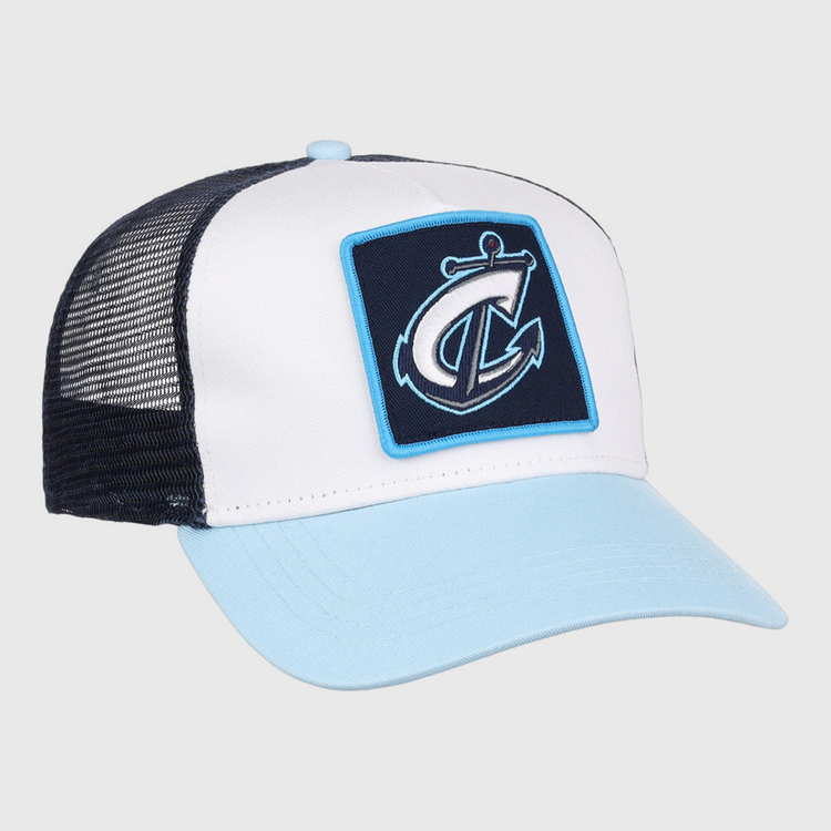 The Ebbets Field Columbus Clippers MiLB Trucker Ballcap features a light blue brim, white front panel, black mesh back, and a patch with a stylized anchor and letter C on the front.