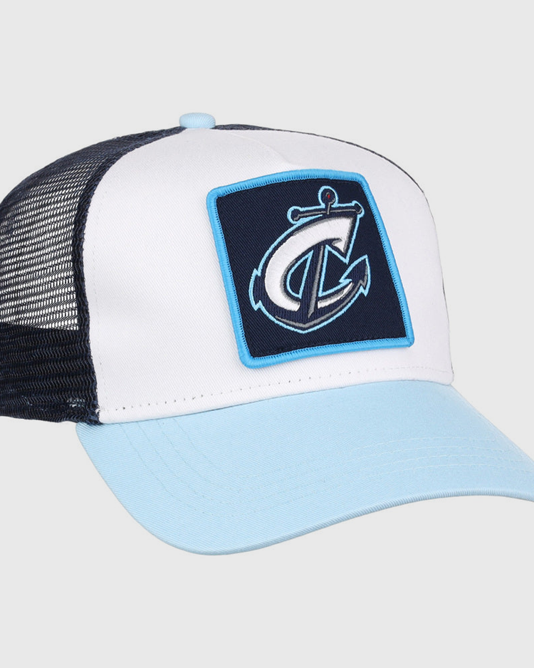 The Ebbets Field Columbus Clippers MiLB Trucker Ballcap features a light blue brim, white front panel, black mesh back, and a patch with a stylized anchor and letter C on the front.