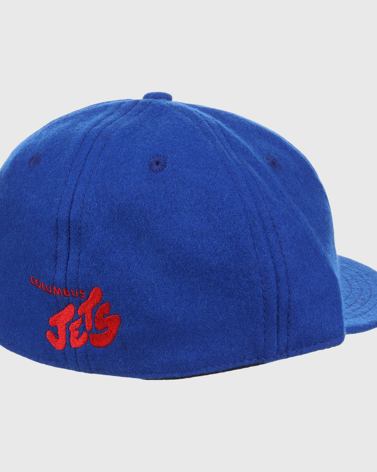 The EFF Columbus Jets Letterhead Wool Vintage Ballcap is shown from behind on a white background, featuring royal blue wool and red embroidered COLUMBUS Jets text on the back left side.