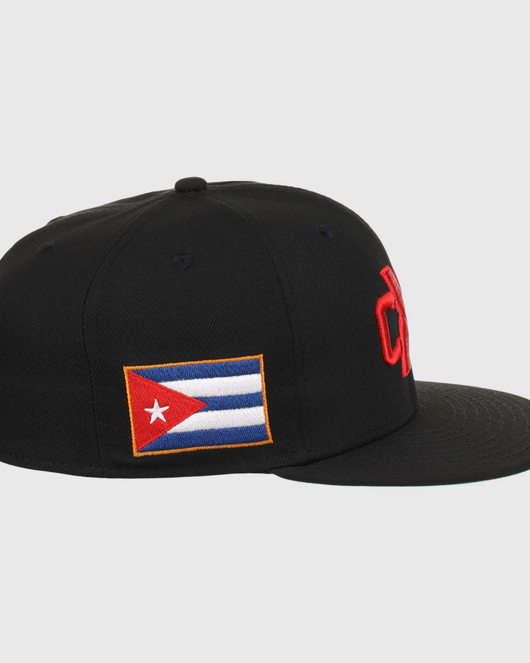 The EFF Cuban X Giants NLB Team Color Fitted Ballcap is black, features a bold red 3D embroidered front logo and a Cuban flag patch on the side, shown here in a side view.