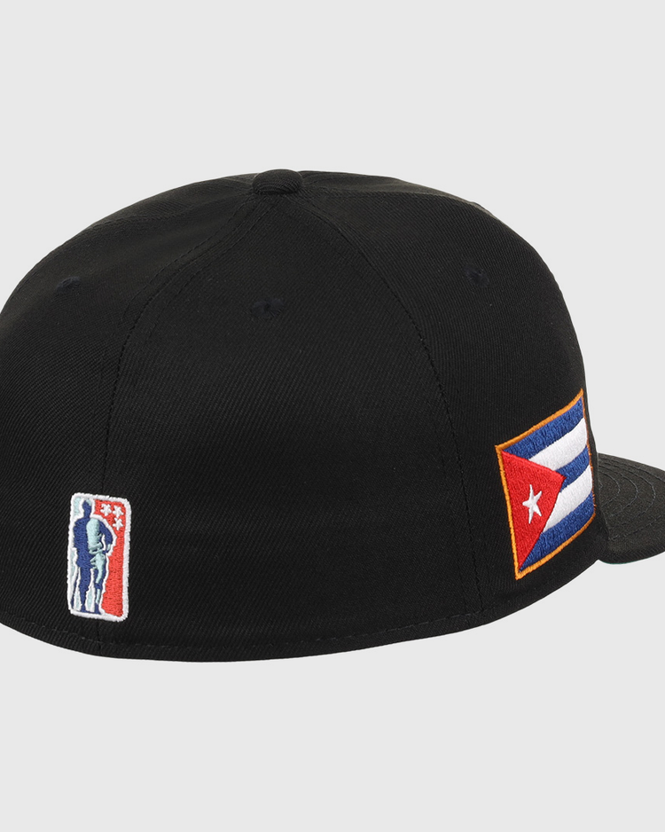 The EFF Cuban X Giants NLB Team Color Fitted Ballcap is a black hat with a Cuban flag patch on the side and a small 3D embroidered baseball player logo near the back.