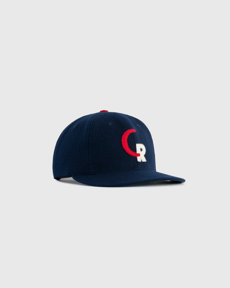 The EFF Caguas-Rio Piedras Criollos 1956-57 Authentic Wool Ballcap in navy features a red and white CR logo on the front, shown against a plain light gray background.