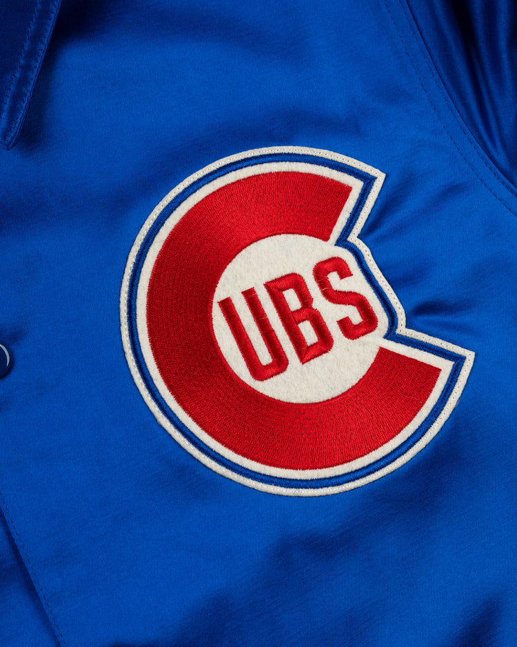 Close-up of the EFF Chicago Cubs 1946 Satin Windbreaker Jacket, featuring a bold red C with UBS inside, outlined in white and blue—a vintage must-have for any Cubs fan’s collection.