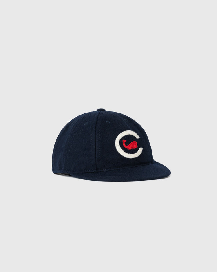 The EFF Chicago Whales 1915 Authentic 8-Panel Soft Short Brim Ballcap is a navy blue vintage wool cap with a curved brim, featuring a large white C and small red detail on the front, shown on a plain light gray background.
