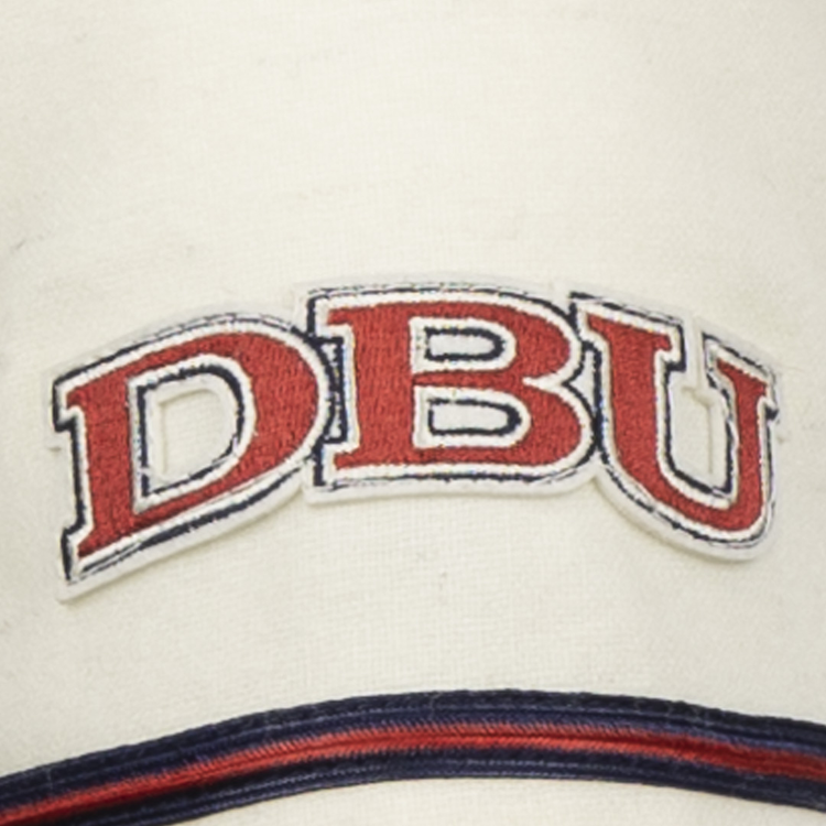 The EFF Dallas Baptist University Home Jersey features a cream base with bold red DBU letters outlined in blue, and navy and red stripes below, evoking a classic collegiate style.