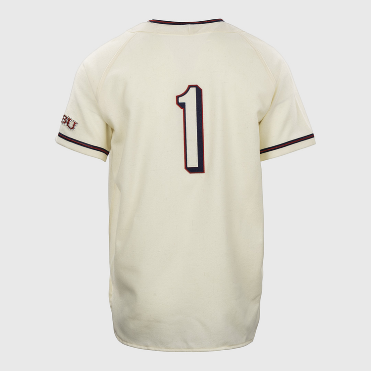 The EFF Dallas Baptist University Home Jersey is cream-colored with dark piping on the sleeves and collar, features a bold number 1 on the back, and has SBU lettering on the left sleeve.