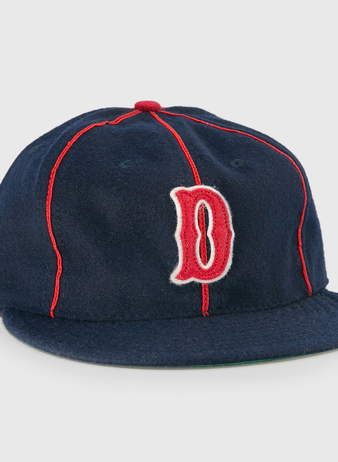 The EFF Danville Veterans 1932 Vintage Ballcap is a navy blue wool hat with red piping, a red and white outlined letter D, flat brim, and classic red button—ideal for collectors of historic ballcaps.