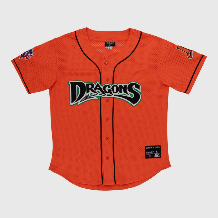 The Ebbets Field Dayton Dragons MiLB Button Down Jersey features a bright orange body with black trim, 