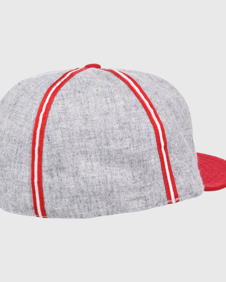 The Daytona Beach Islanders 1936 Vintage Ballcap by Ebbets Field Flannels features a gray crown with red and white stripes, a solid red brim, and is shown from the back on a white background—an authentic reproduction of the original.