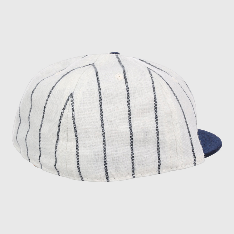 The EFF Duke University Pinstripe Script Vintage Ballcap features navy blue pinstripes, a solid navy brim, and is an authentic 1968 reproduction shown from the rear side angle.