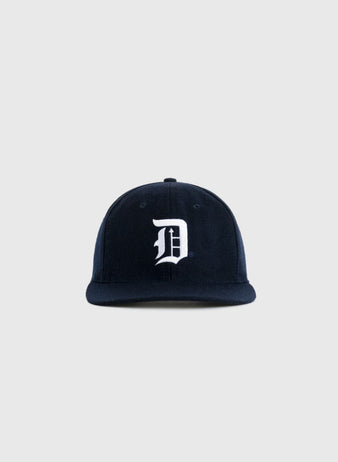 The Duke University 1968 Authentic Wool Ballcap by EFF features navy wool with a white embroidered D on the front, evoking vintage style. Shown against a plain light gray background.
