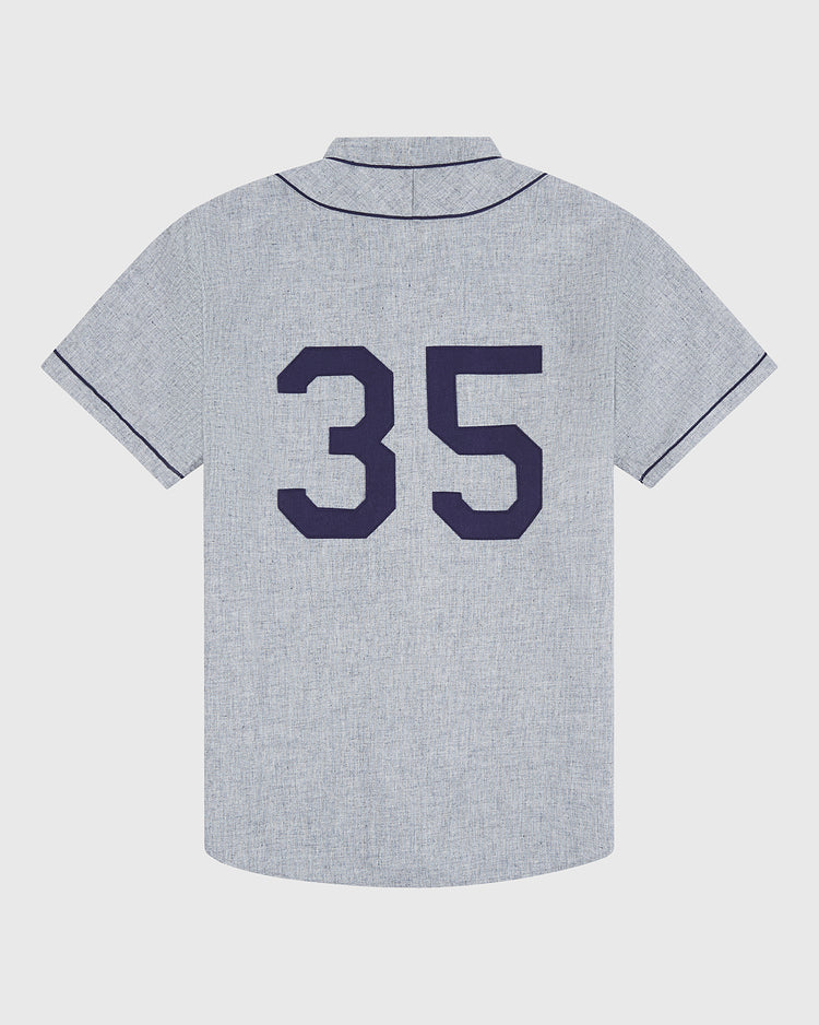 Ebbets Field’s Brooklyn Eagles 1935 Authentic Wool Road Jersey features a classic light gray design with dark piping and a prominent navy blue number 35 on the back, faithfully reproducing the iconic look of the original Negro Leagues team.