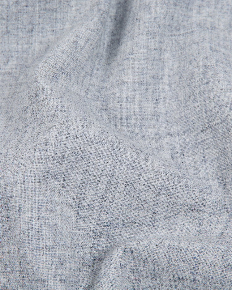 Soft light gray wool fabric with a subtle woven texture and gentle folds, creating natural shadows and a slightly crumpled appearance—reminiscent of the material used in the Ebbets Field Brooklyn Eagles 1935 Authentic Wool Road Jersey.