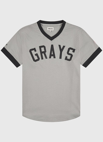The Ebbets Field Homestead Grays V-Neck Mesh Jersey showcases a timeless gray design with black trim on the collar and sleeves, featuring GRAYS in bold black lettering across the chest as an homage to the iconic jerseys worn by the legendary Negro Leagues team.