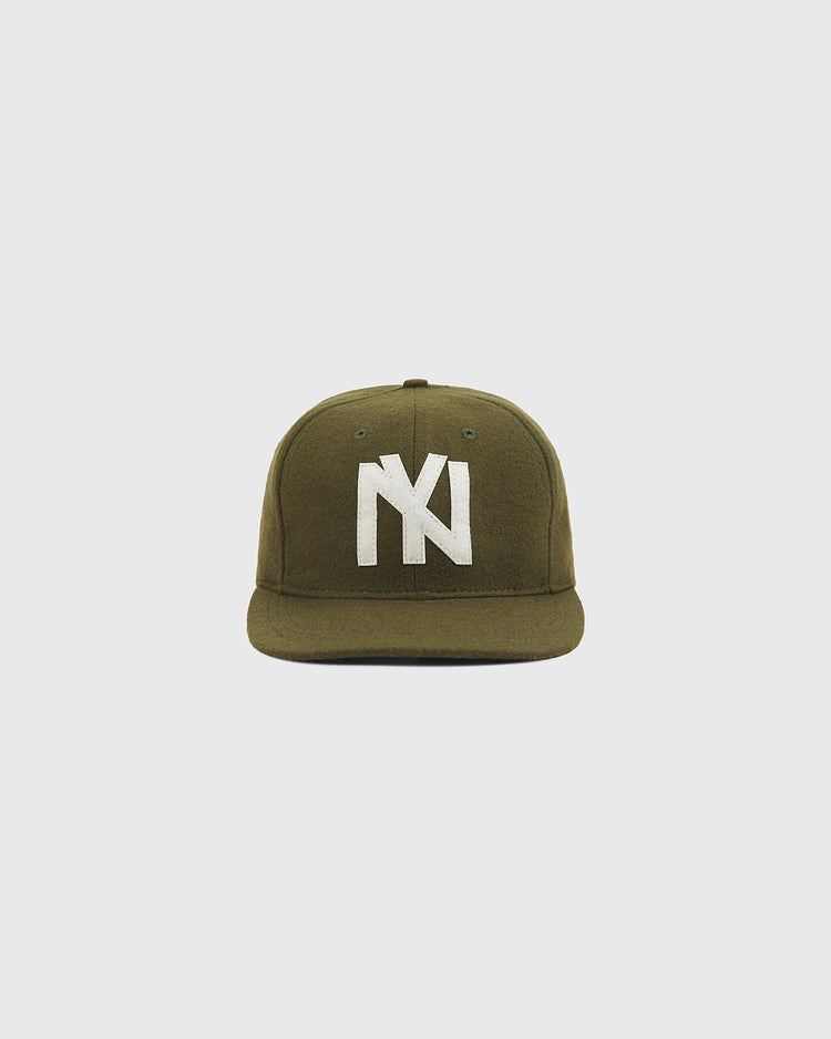 The Brooklyn Eagles 1935 Wool Ballcap by Ebbets Field is crafted from olive green wool, features a flat brim and a bold white interlocking NY logo embroidered on the front, and is photographed against a plain light background—evoking the classic style of the 1935 Negro Leagues team.