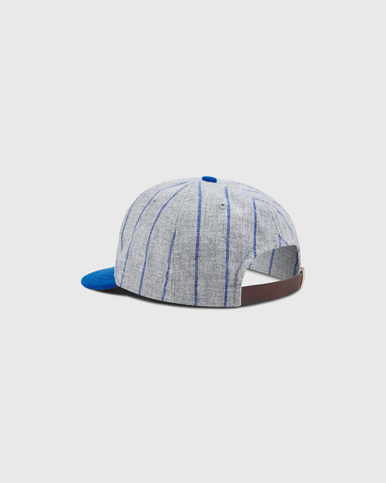 The Brooklyn Royal Giants Authentic Wool Ballcap by Ebbets Field features a gray and blue pinstriped wool design, a blue brim, and a brown adjustable strap at the back. Inspired by the legacy of Black baseball history and teams like the Brooklyn Royal Giants, it is shown against a plain light background.